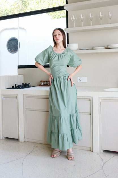 Amalfi linen long dress in green colour presented by model in minimalistic design Bali vila.