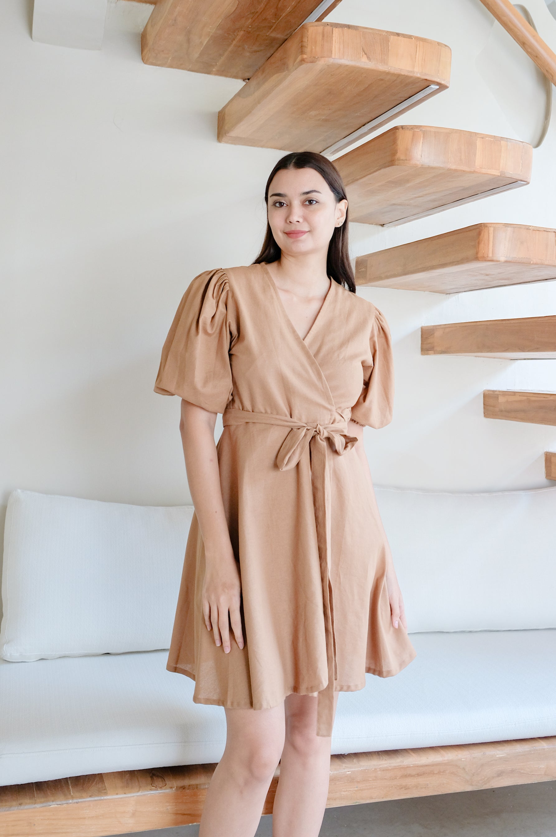 Model showing brown linen kimono dress with ties by Una Linen Havn.